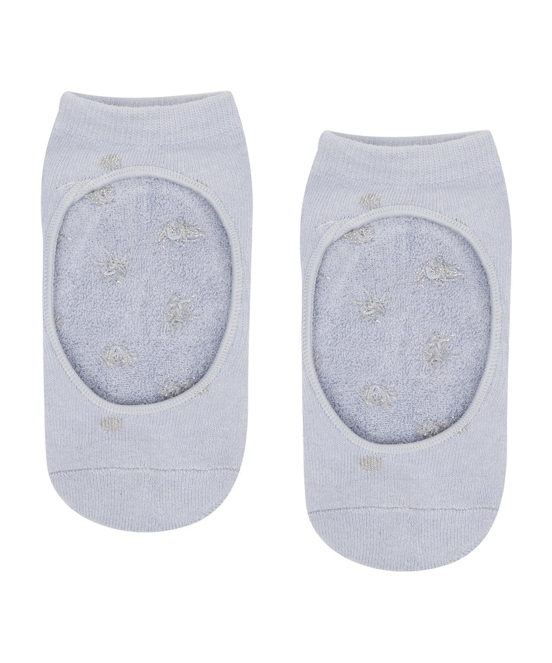 Soft and stretchable baby blue socks with non-slip grip and silver sparkle spots