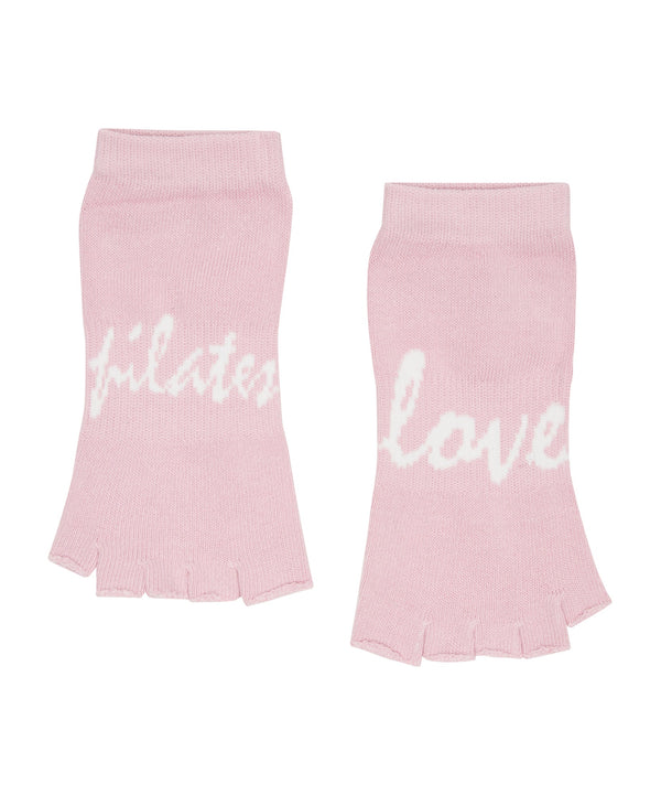 Pair of dusty pink Toeless Non Slip Grip Socks with Love Pilates design, perfect for enhancing stability and comfort during Pilates workouts