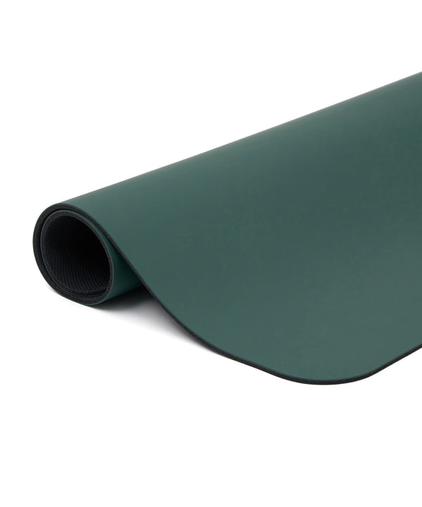 High-quality pilates reformer mat made of vegan leather in a beautiful forest green color