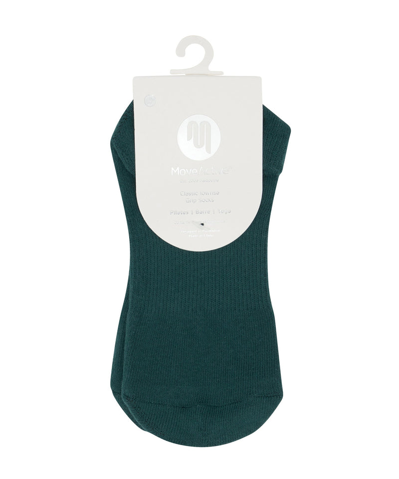 Low rise grip socks in a deep forest green color, perfect for workouts